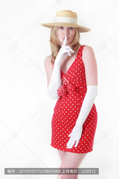 迷人的女人用手指在她的嘴唇-不要告訴
