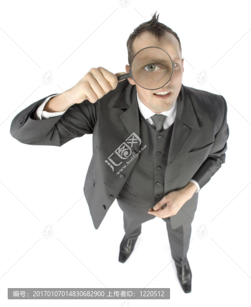 帶有放大鏡的商人