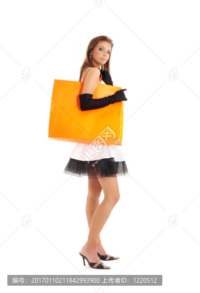 優(yōu)雅的女士與橙色購物袋