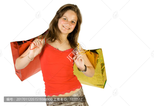 快樂的年輕女孩帶著購物袋
