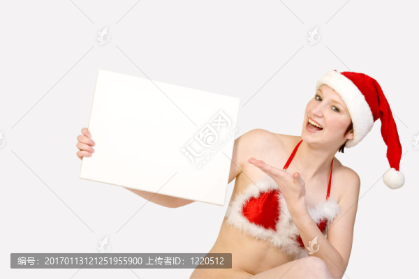 圣誕女孩舉起分隔開的白色標(biāo)志