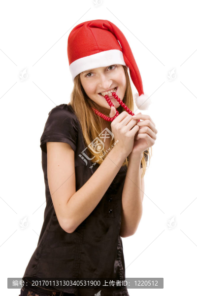 漂亮的女孩在紅色的圣誕老人帽