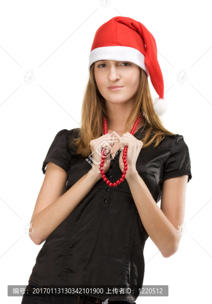 漂亮的女孩在紅色的圣誕老人帽