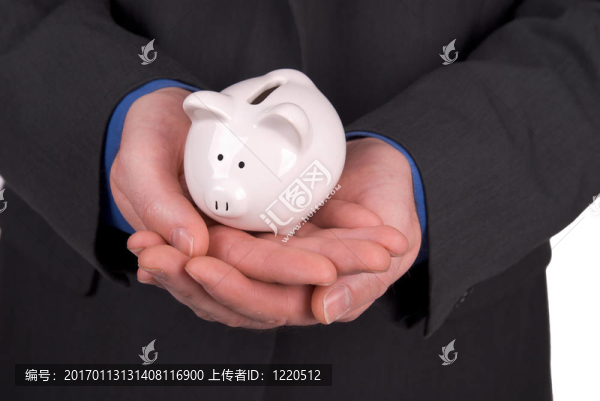 商人拿著一只小豬銀行