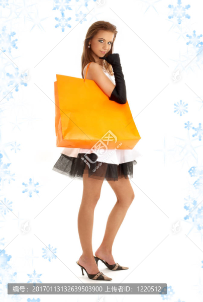 優(yōu)雅的女士與橙色購物袋和雪花2