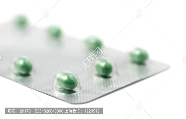 綠色藥丸箔包裝在白色