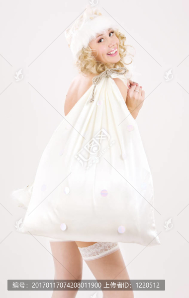 歡快的圣誕老人幫手女孩大袋