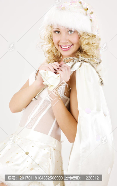歡快的圣誕老人幫手女孩大袋