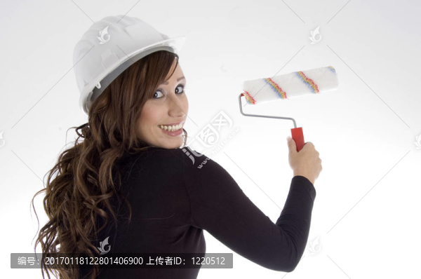 婦女與建筑師頭盔和油漆刷