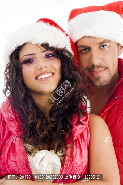 年輕情侶情侶戴圣誕帽