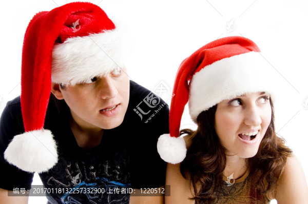 戴圣誕帽的年輕夫婦肖像