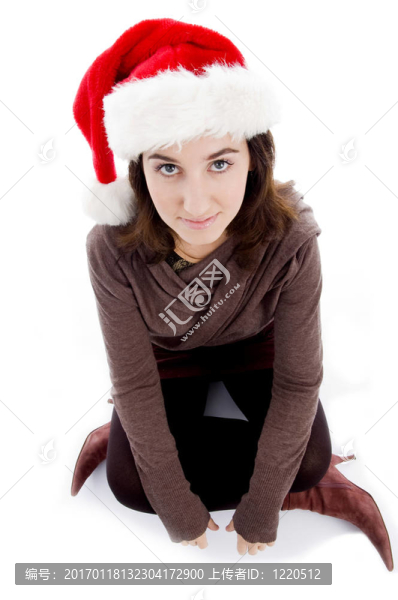 女子圣誕帽坐在地板上