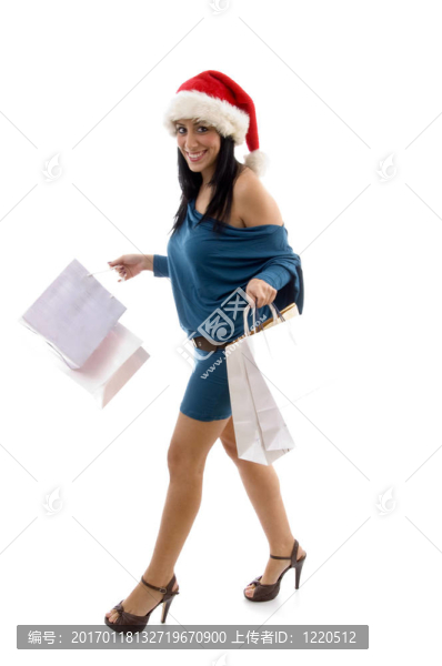 面帶微笑的圣誕女性抱著拎包