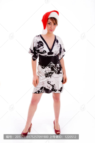 年輕女子戴圣誕帽的全身姿態(tài)