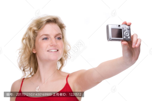 帶數(shù)碼相機的女人