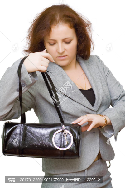 一個穿著灰色西裝的年輕女人的肖像