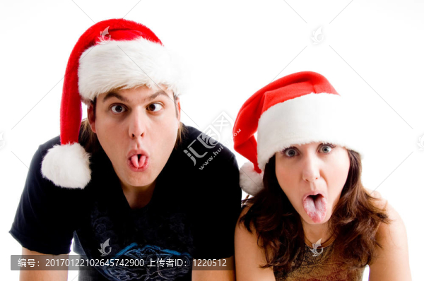 戴著圣誕帽和做鬼臉的人