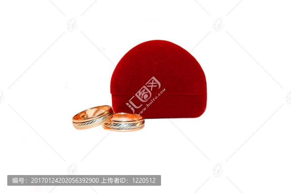 兩個(gè)結(jié)婚戒指和紅色的枕頭