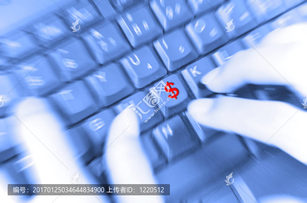 美元符號和手指在鍵盤上運動模糊