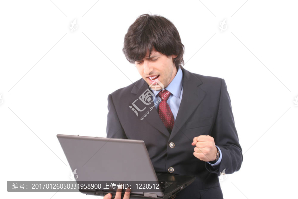 年輕快樂的商人與筆記本電腦工作