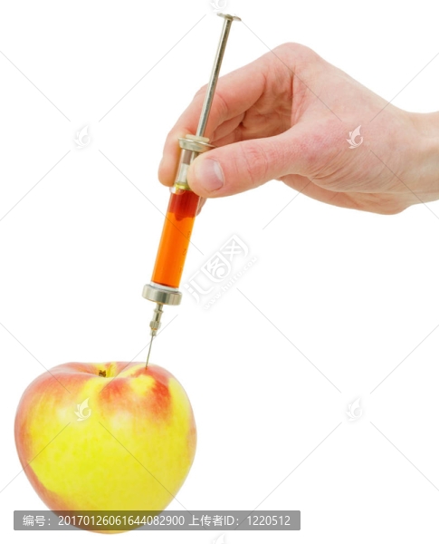 用注射器和蘋果的手