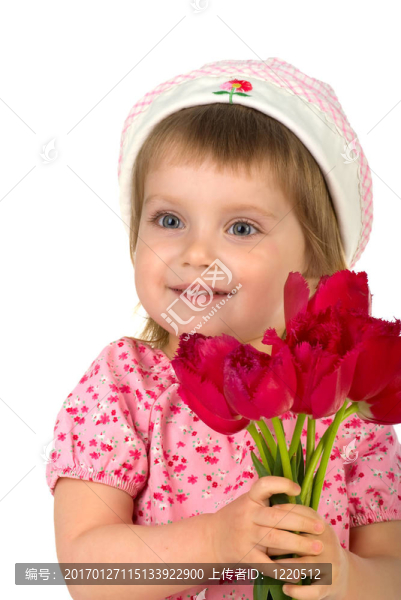 可愛的小女孩給粉紅色的郁金香