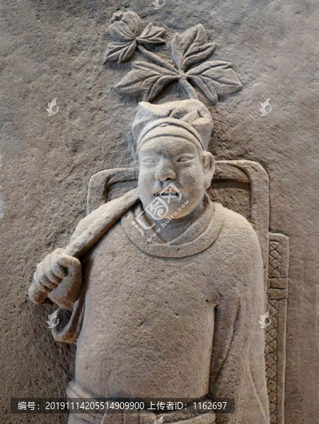 負(fù)簍男侍石刻