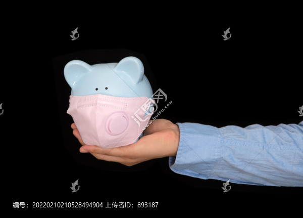 一個(gè)戴口罩的小豬存錢(qián)罐