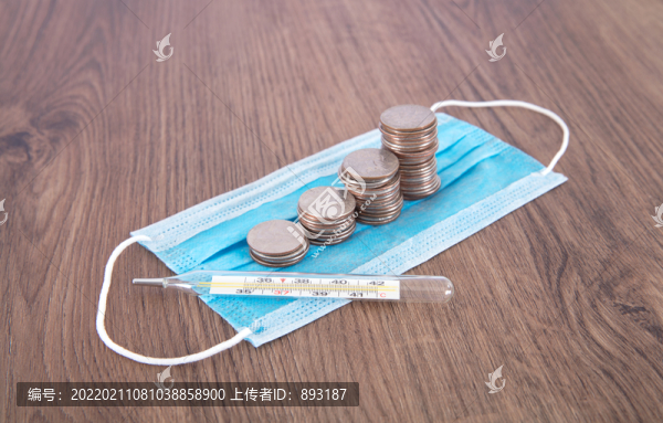 一排美元硬幣及一支溫度計(jì)