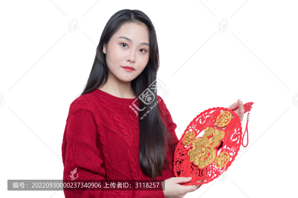 年輕女性手拿窗貼福字