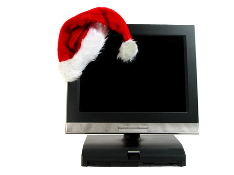 圣诞老人的帽子在台式电脑上