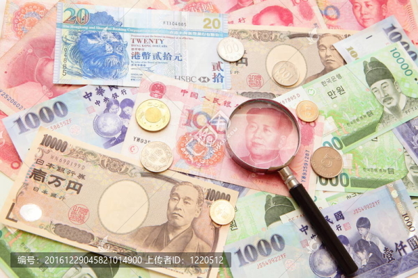亚洲货币；放大镜和背景（包括亚洲货币韩元；台湾元；中国货币元；香港美元；日元）